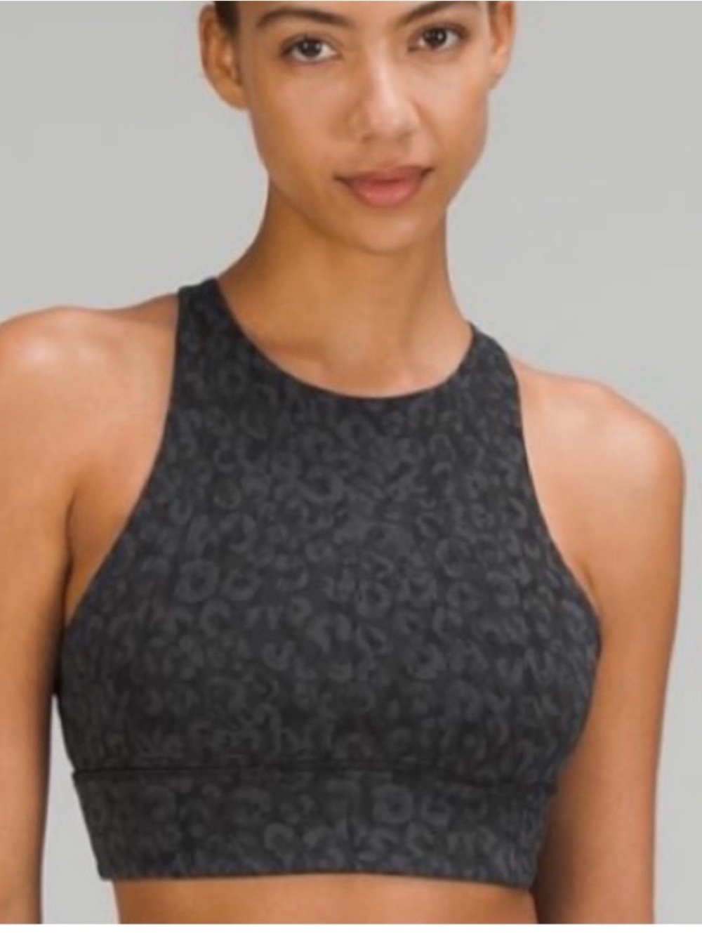Lululemon high neck energy bra, size 4 black animal print